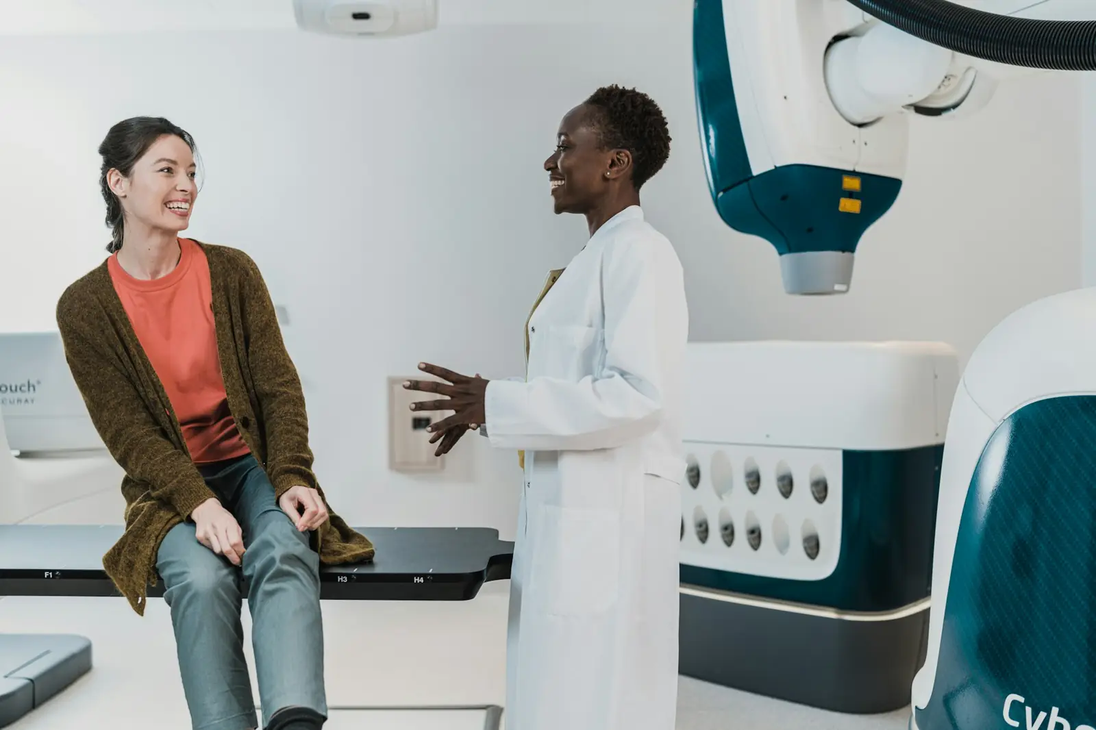 A patient talking with a doctor in a modern clinic